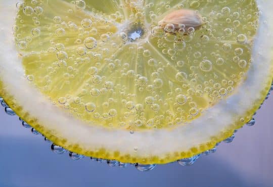yellow lemon with water droplets