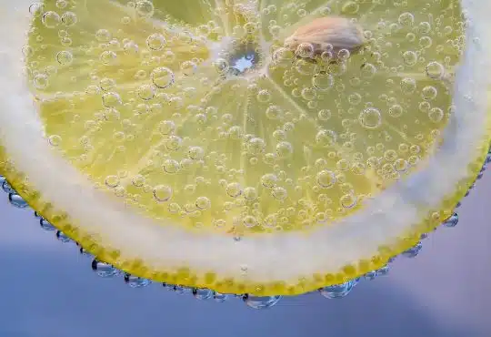 yellow lemon with water droplets