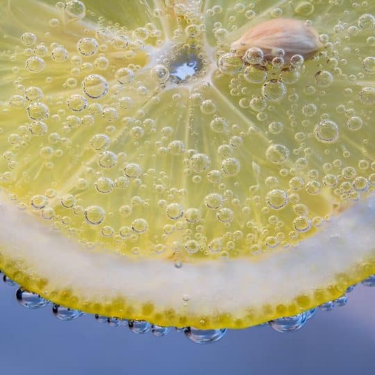 yellow lemon with water droplets